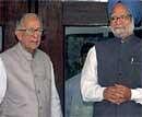 Former West Bengal Chief Minister and CPI (M) leader Jyoti Basu (L) with Prime Minister Manmohan Singh in Kolkata. File Photo. PTI