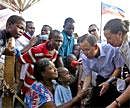 UN chief Ban Ki Moon speaks with displaced Haitians during his trip to Haiti. AFP