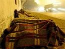 In a picture taken on January 7, 2010 Indian homeless people sleep on a pavement in New Delhi. AFP