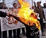 Pakistani cricket fans burn an effigy of IPL Commissioner Lalit Modi during a protest in Lahore on Wednesday. AFP