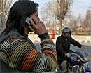 A Kashmiri youth talking on mobile phone after the Union Home Ministry lifted its three months ban on prepaid mobile connections in Valley, in Srinagar on Thursday. PTI