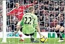 Arsenals Cesc Fabregas (left) shoots past Bolton goalkeeper Jussi Jaaskelainen on Thursday. REUTERS