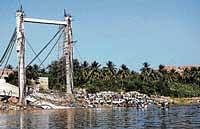 Ill-fated: The remains of a bridge on river Tungabhadra in Anegundi in Koppal which collapsed a year ago. dh photo
