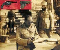 Seth Trilok Singh Chawla (R) with Netaji in Thailand in the 1940s. Inset:: Two pistols -- a Colt.32 and a FN .635 -- belonging to Netaji Subhas Chandra Bose. IANS photos
