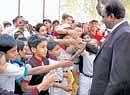 Police Commissioner Shankar Bidari interacting with students during the launch of the traffic awareness campaign for schoolchildren in Bangalore on Friday. DH photo