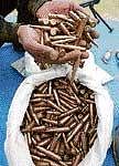 A policeman shows ammunition recovered in Baramullah district on Sunday. PTI