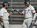 India's Sachin Tendulkar (L), greets teammate Rahul Dravid after their world record number of  partnerships on Monday in the second cricket Test match against Bangladesh in Dhaka. AP