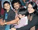 Together: Upendra and Priyanka with their children.