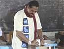Sri Lankan President Mahinda Rajapaksa casts his vote at a polling booth near Madamulana, south of Colombo, Sri Lanka, Tuesday. AP