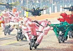 Here to entertain: Soldiers in colourful  uniform perform on motorcycles during the Republic Day parade in New Delhi on Tuesday. AP
