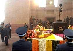 Prime Minister Manmohan Singh paying homage to soldiers at Amar Jawan Jyoti on the occasion of Republic Day in New Delhi on Tuesday. PTI