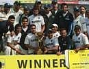 India cricket players pose with the winning trophy at the presentation ceremony after the second cricket test match between India and Bangladesh, in Dhaka, AP