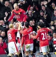 ON TOP: United's Michael Carrick (2nd from left) celebrates with team-mates after scoring against Manchester City in the League Cup second leg semifinal match. AP