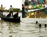 Villagers during rescue operations after an overcrowded boat capsized in Godavari river in West Godavari district of Andhra Pradesh early on Saturday morning. PTI