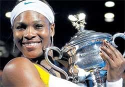 MY BABY: Serena Williams with the Daphne Akhurst Memorial Cup after winning the Australian Open womens singles final against Justine Henin on Saturday.  REUTERS