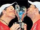 Cup that cheers: Mike and Bob Bryan with their prize. AFP