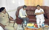 Taking Stock: Deputy Commissioner Anwar Pasha briefing  Home Minister Dr V S Acharya in Chikkaballapur on Saturday. Superintendent of Poilce Raviprasad is also seen. DH Photo