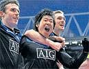 Silencing the gunners: Manchester United's Park Ji-Sung (centre) celebrates his goal against Arsenal with teammates Darren Fletcher (right) and Michael Carrick on Sunday. AP