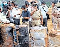 Forensic experts examining barrels containing chemical waste at the railway yard in Srirampura. DH file photo