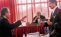 Advocates Ibrahim and L N Hegde arguing over a point during the sitting of Justice B K Somasekhara Commission of Enquiry at Circuit House in Mangalore on Wednesday. DH Photo