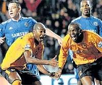 What a surprise: Hull Citys Steven Mouyokolo (right) celebrates after scoring against Chelsea on Tuesday. AP