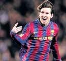 Barcelonas Lionel Messi celebrates after scoring against Getafe at Camp Nou on Sunday. AP