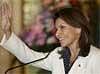 Costa Rica's President-elect Laura Chinchilla waves to supporters during a visit to the Basilica Virgin de Los Angeles in Cartago, Costa Rica, Monday. AP