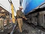 Jawans of Railway Protection Force examine railway tracks after maoists called a 72-hour bandh in Jharkhand since Sunday. PTI