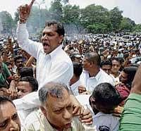 On the boil: Sri Lankan opposition supporters shout slogans as they stage a protest against the arrest of former army chief Sarath Fonseka in Colombo on Wednesday. AFP