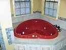 The heart-shaped Jacuzzi is designed for two.