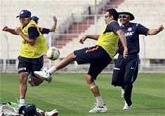 Indian cricketers Zaheer Khan, Suresh Raina and Virender Sehwag play football during a practice session at Eden Garden in Kolkata on Friday. PTI