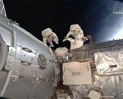 This image taken from video and made available by NASA shows astronauts Robert Behnken and Nicholas Patrick during their spacewalk as they work outside the International Space Station on Saturday. AP