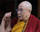 Tibetan spiritual leader the Dalai Lama gestures as he speaks to a crowd after leading a prayer session marking the beginning of the Tibetan New Year at the Tsuglakhang temple in Dharmsala on Sunday. AP