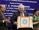 Union Minister for Human Resource Development Kapil Sibal unveiling the logo of National Institute of Open Schooling as MoS D. Purandeswari and NIOS Chairman S S Jena clap, during NIOS' annual meeting in New Delhi on Monday. PTI