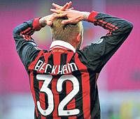 Fingers crossed:  AC Milans David Beckham will be hoping to dent his former club Manchester Uniteds chances. AFP