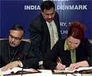 A Didar Singh, Secretary, Minister of Oerseas Indian Affairs, and Inger Stojberg, Minister of Employment, Denmark, signing an agreement for social security between the two countries, in New Delhi on Wednesday. PTI