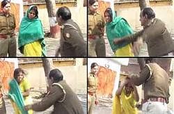 A Video grabs shot by a freelancer shows a police officer beating a dalit women in UP. Photo Courtesy NDTV