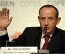 This file photo taken on December 19, 2009 shows the Executive-Secretary of the UN Climate Conference Yvo de Boer raising his hand during a press conference on on the 13th day of the COP15 UN Climate Change Conference in Copenhagen. AFP