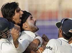 India's Harbhajan Singh, center, Ishant Sharma, second from left and others celebrate their victory over South Africa during the second test cricket match in Calcutta on Thursday. AP