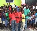 Haitian children line up to receive a free meal at a local restaurant in Petionville on Thursday. AP