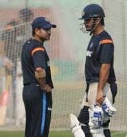 A File photo of Indian cricketer Sachin Tendulkar (L)  with captain Mahendra Singh Dhoni during a practice session (AFP)