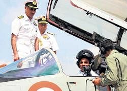 In full control: Defence Minister A K Antony sits in the cockpit of a MiG-29K at the models induction ceremony at the Goa naval base on Friday. AFP