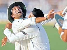 Joy unbound: Sachin Tendulkar and Harbhajan Singh celebrate Indias victory in Kolkata on Friday. Reuters