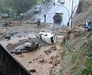 Cars carried down a hillside by floodwaters outside Funchal, the Madeira Island's capital on Saturday. AP