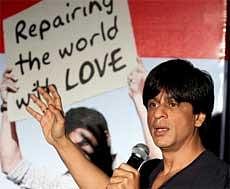 Shahrukh Khan interacts with moviegoers watching his movie 'My Name Is Khan' at a cinemax in Mumbai on Saturday evening. PTI