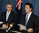 Japanese Foreign Minister Katsuya Okada (R) and his Australian counterpart Stephen Smith conduct a press conference in Perth on  Sunday. AFP