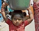 Residents of Pulakeshi Nagar take part in a protest rally against erratic water supply on Monday. DH photo