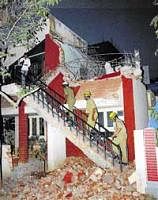 Fire personnel inspecting a portion of the building that collapsed at Jayanagar  7th block on Monday. DH Photo