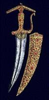 A dagger and scabbard set with 2, 400 precious stones on display in Singapore. PTI