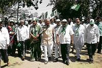 Seeking justices JD(S) workers taking out a protest march against the forceful acquisition of farmers land, in Chikkaballapur on Tuesday. DH Photo